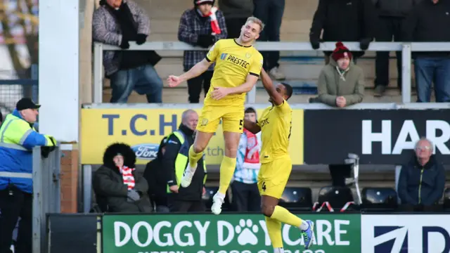 Burton celebrate a goal against Lincoln