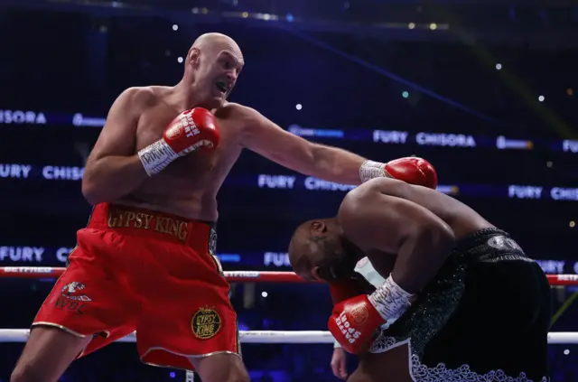 Tyson Fury punches Derek Chisora