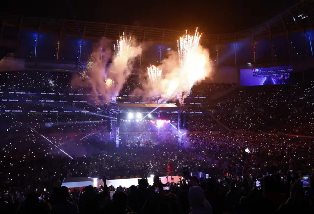 Flames and lights are captured during Tyson Fury's ring walk