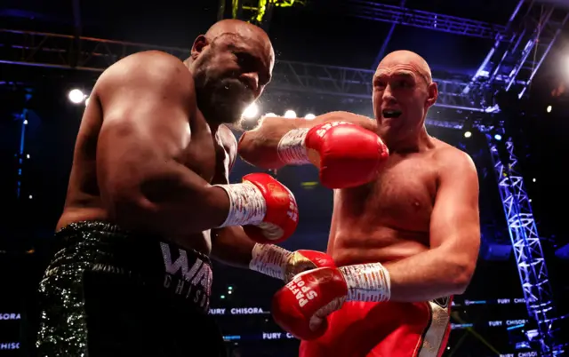 Tyson Fury punches Derek Chisora