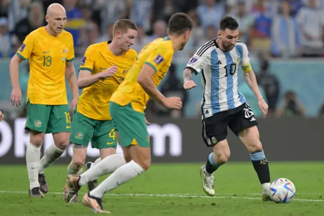 Argentina's forward #10 Lionel Messi (R) fights for the ball with Australia's defender #05 Fran Karacic (2ndR), Australia's defender #04 Kye Rowles (2ndL) and Australia's midfielder #13 Aaron Mooy during the Qatar 2022 World Cup round of 16 football match between Argentina and Australia at the Ahmad Bin Ali Stadium in Al-Rayyan, west of Doha on December 3, 2022