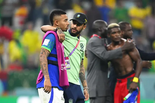 Gabriel Jesus is hugged by Neymar