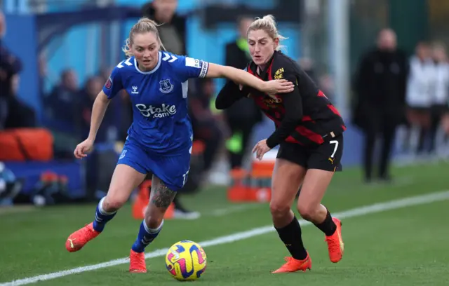 Lucy Graham of Everton and Laura Coombs of Manchester City compete for the ball