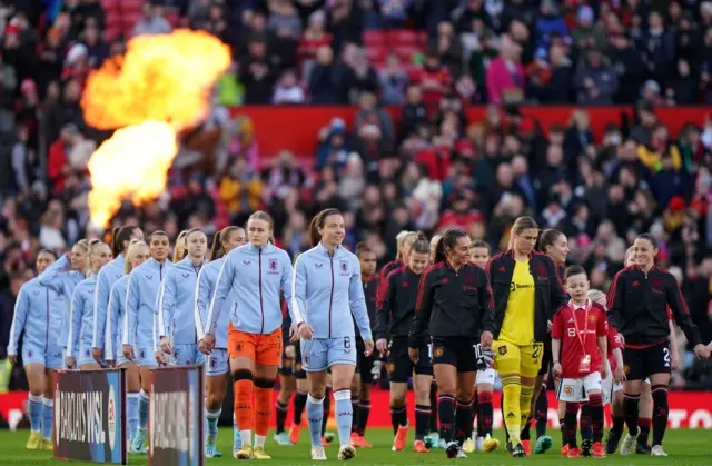 Players line up at Old Trafford