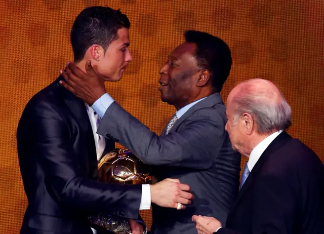 Cristiano Ronaldo of Portugal receives the FIFA World Player 2008 award from soccer legend Pele