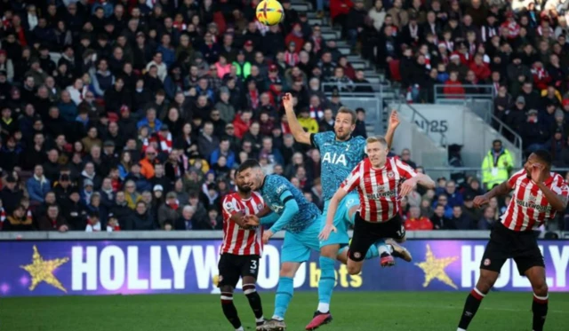 Harry Kane heads in against Brentford