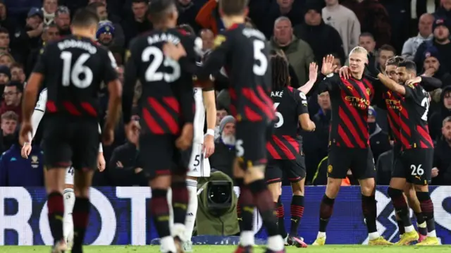 Man City celebrate Erling Haaland scoring at Leeds