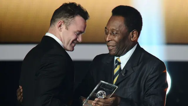 Wayne Rooney (L) receives from Brazilian football legend Pele the FIFA/FIFPro World XI award on January 9, 2012 at the Kongresshaus in Zurich during the FIFA Ballon d'Or event.