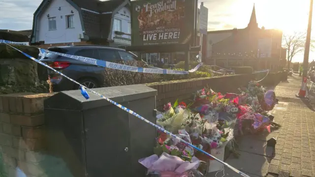 Flowers have been left for Elle Edwards outside the Lighthouse Pub in Wallasey