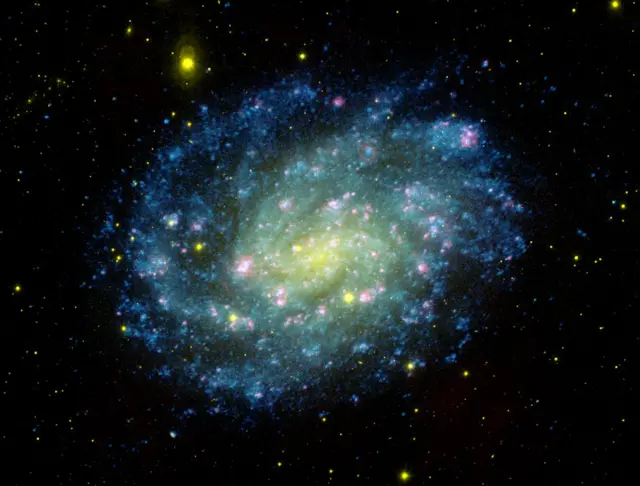 Nasa release an image of a spiral galaxy in the constellation, Sculptor, showing the colours of Brazil