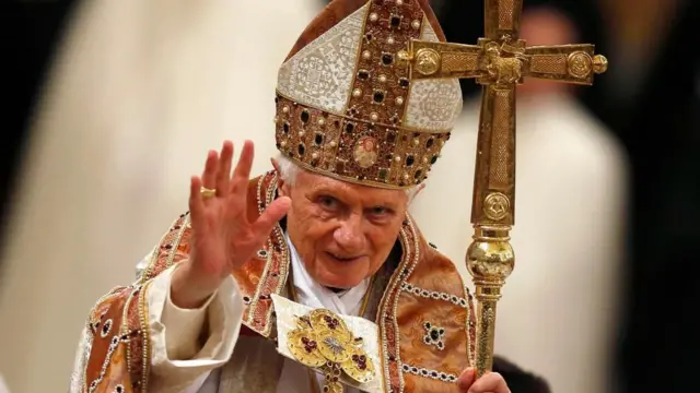 Pope Benedict XVI waving at the end of a Vespri mass at the Basilica of Saint Paul Outside The Walls in Rome January 25, 2013