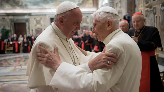 Former pope Benedict (R) is greeted by Pope Francis during a ceremony to mark his 65th anniversary of ordination to the priesthood at the Vatican in June 2016