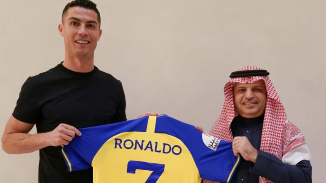 Cristiano Ronaldo (left) holds Al-Nassr shirt