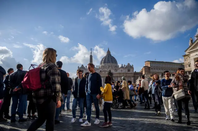 People gather at St Peter's Square after the announcement of the death of former Pope Benedict XVI on 31 December 2022 in Vatican City, Vatican