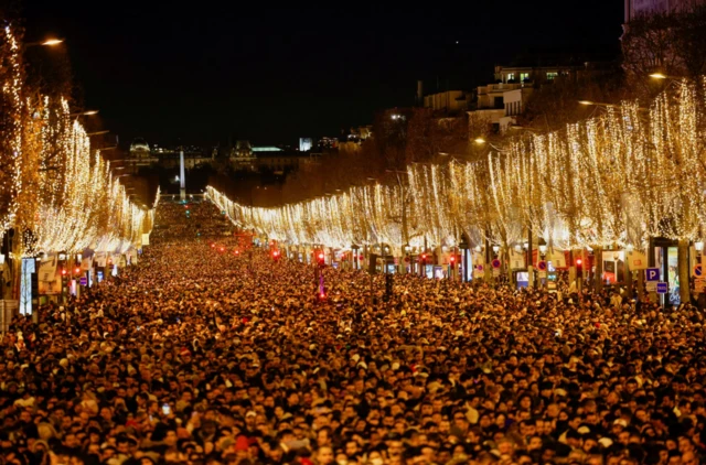 People gather on the Champs Elysees