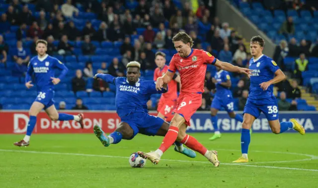 Blackburn Rovers' Sam Gallagher has a shot at goal while under pressure from Cardiff City's Cedric Kipre during the Sky Bet Championship between Cardiff City and Blackburn Rovers