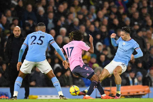 Jack Grealish (R) in a challenge with  Alex Iwobi