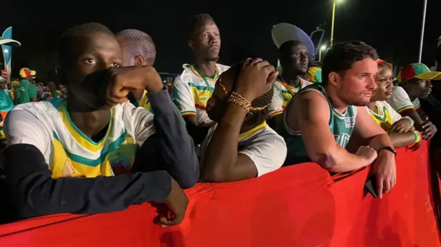 Sad looking Senegal fans