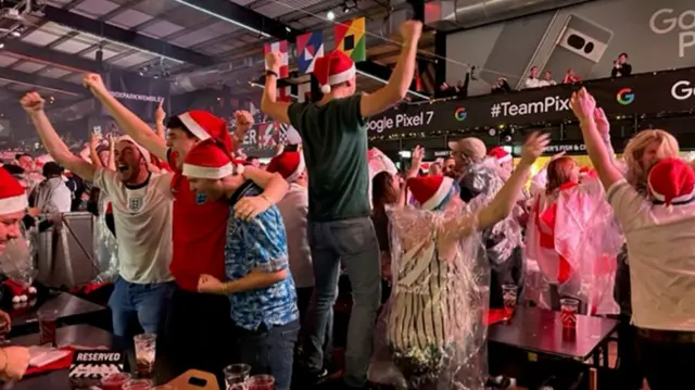 Fans in Wembley Box Park celebrate England's second goal