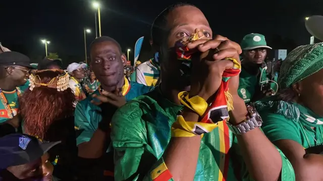 Senegal fans looking upset in Dakar after England score