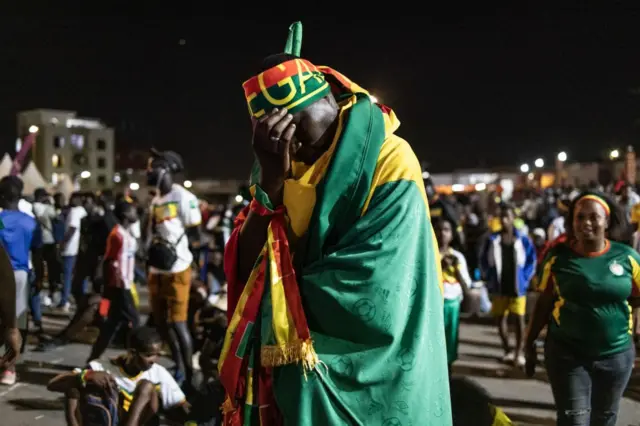 A Senegalese supporter reacts during the Qatar 2022 World Cup football match between Senegal and England