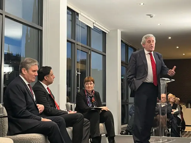 Gordon Brown speaking with Keir Starmer, Anas Sarwar and Sarah Boyack sitting behind