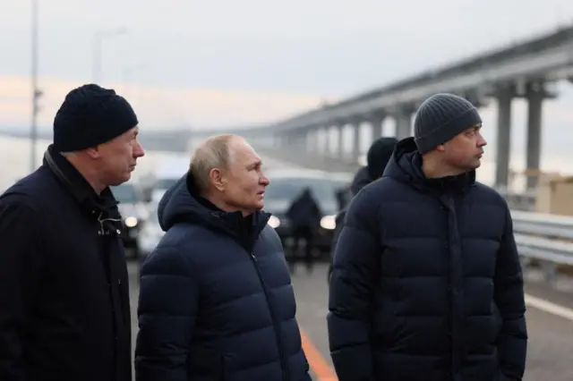 Russian President Vladimir Putin visits a bridge connecting the Russian mainland with the Crimean Peninsula