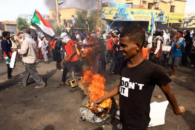 Protesters march during a rally against military rule