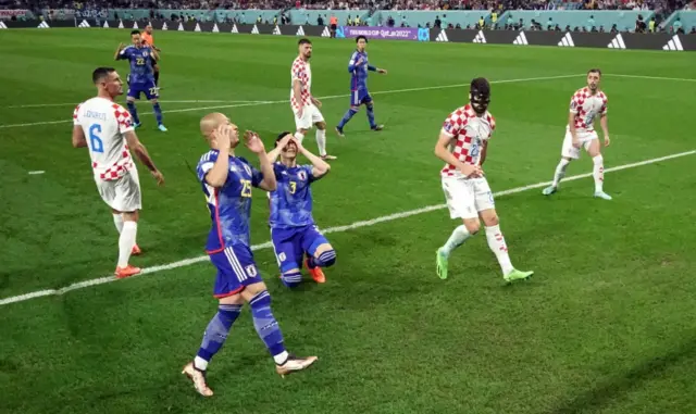 Japan players put hands on their heads