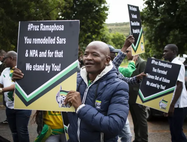 Supporters of South African President Cyril Ramaphosa march prior to his arrival at the National Executive Committee of the African National Congress