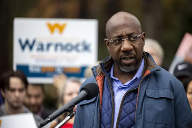 Raphael Warnock speaking to supporters