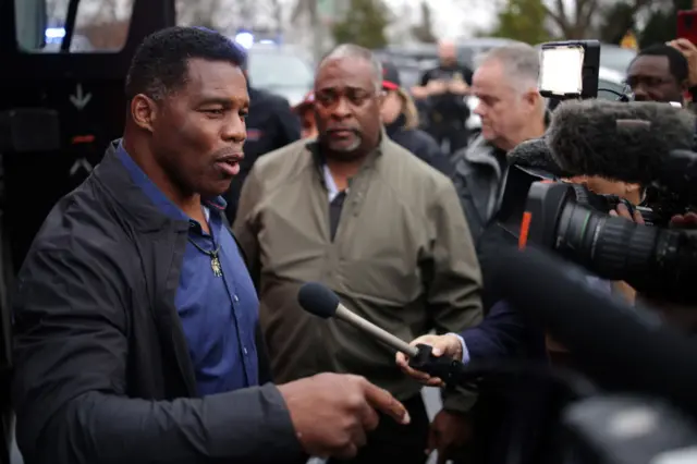 Herschel Walker speaking to reporters