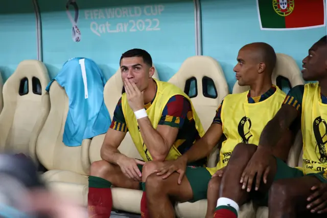 Cristiano Ronaldo watches on from the bench as Portugal play Switzerland.