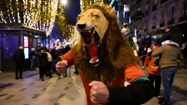 Moroccan supporters celebrate victory in Paris