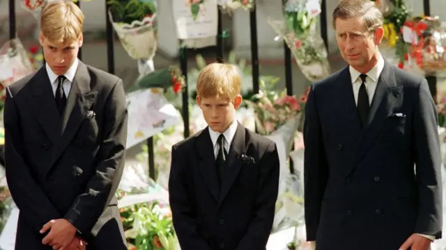 Prince Charles, Prince Harry and Prince William look at the coffin of Diana, Princess of Wale