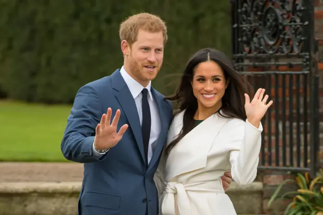 Prince Harry and Meghan Markle in the Sunken Garden at Kensington Palace after the announcement of their engagement