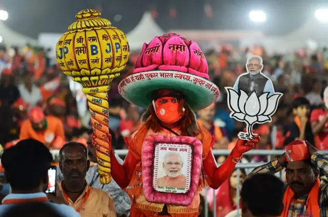 Bhartiya Janta Party (BJP) supporter wearing a costume attends a party rally addressed by Indian Prime Minister Narendra Modi ahead of 2nd phase of Gujarat's assembly election, in Ahmedabad on December 2, 2022