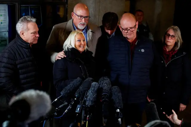 Harry's mother, Charlotte Charles (centre left) speaks to reporters outside the Old Bailey