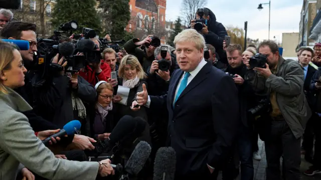 Boris Johnson delivers a statement to the media outside his home in London on 21 February 2016