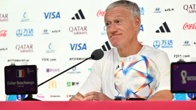 France coach Didier Deschamps talks to the media