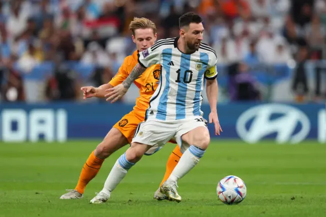 Lionel Messi in action with Netherland's Frenkie de Jong