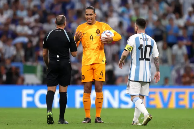 Virgil Van Dijk of Netherlands speaks to Referee Antonio Mateu