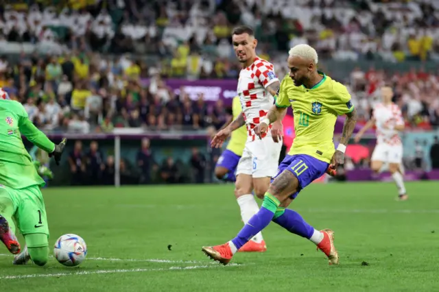 Neymar's shot is saved by Livakovic