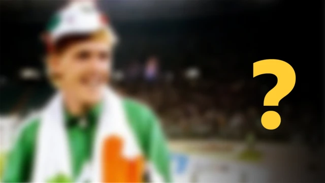 A blurred image of a footballer