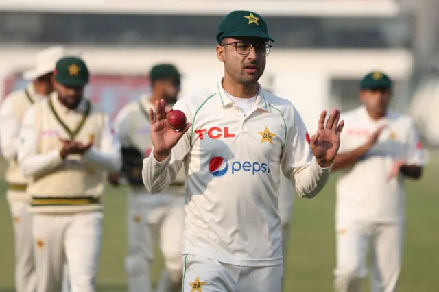 Abrar Ahmed of Pakistan is applauded by his team mates as he leaves the field after taking a seven wicket haul during day one of the First Test Match between Pakistan and England at Multan Cricket Stadium on December 09, 2022 in Multan, Pakistan