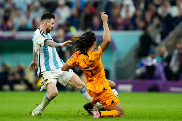 Lionel Messi and Nathan Ake