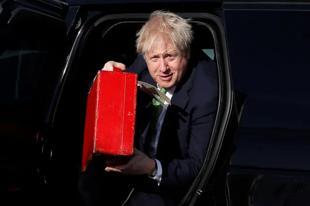 Boris Johnson boards an aircraft as he departs to meet with Ukrainian President Volodymyr Zelenskiy