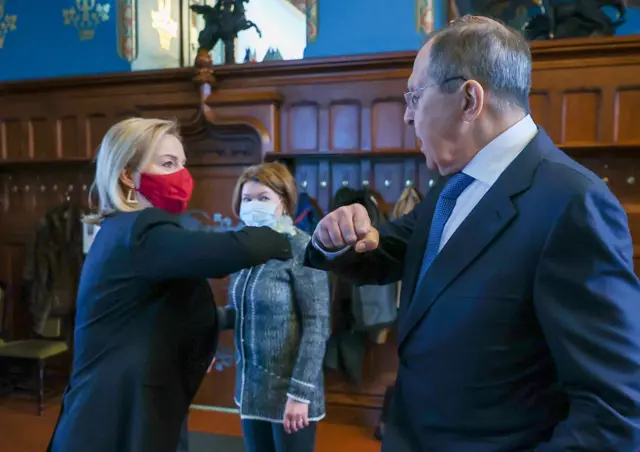 Liz Truss bumps elbows with Russian counterpart Sergei Lavrov