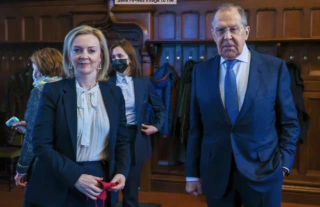 Liz Truss poses with Russian counterpart Sergei Lavrov