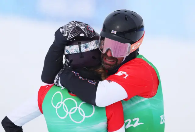 Nick Baumgartner hugs Lindsey Jacobellis